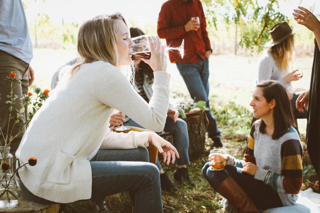 group of friends drinking wine on a wine tour