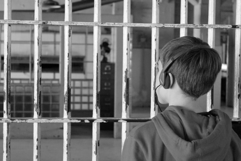 child listening to audio tour while visiting alcatraz