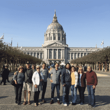 charles-minibus-tour-guide-dylans-tours Group Photo in front of San Francisco City Hall on SF City Tour