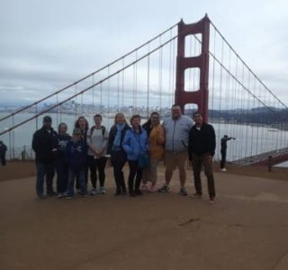 julio-minibus-tour-guide-dylans-tours Group Photo in Front of Golden Gate Bridge