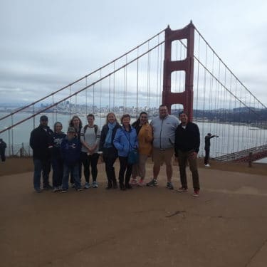 julio-minibus-tour-guide-dylans-tours Group Photo in Front of Golden Gate Bridge