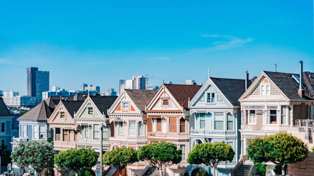 row of colorful houses side by side