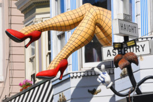 giant fishnet stocking legs hanging out window