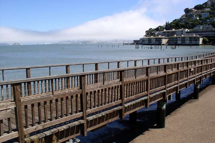 a wooden boardwalk on the sausalito waterfront