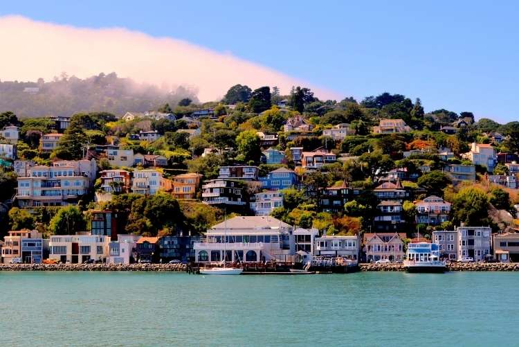 a view of the houses rising up the hill in sausalito from the water