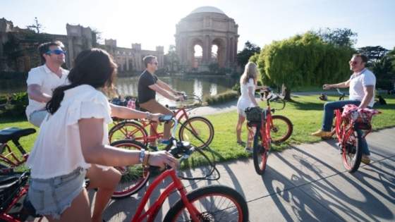 group of bikers at the palace of fine arts on a sunny day