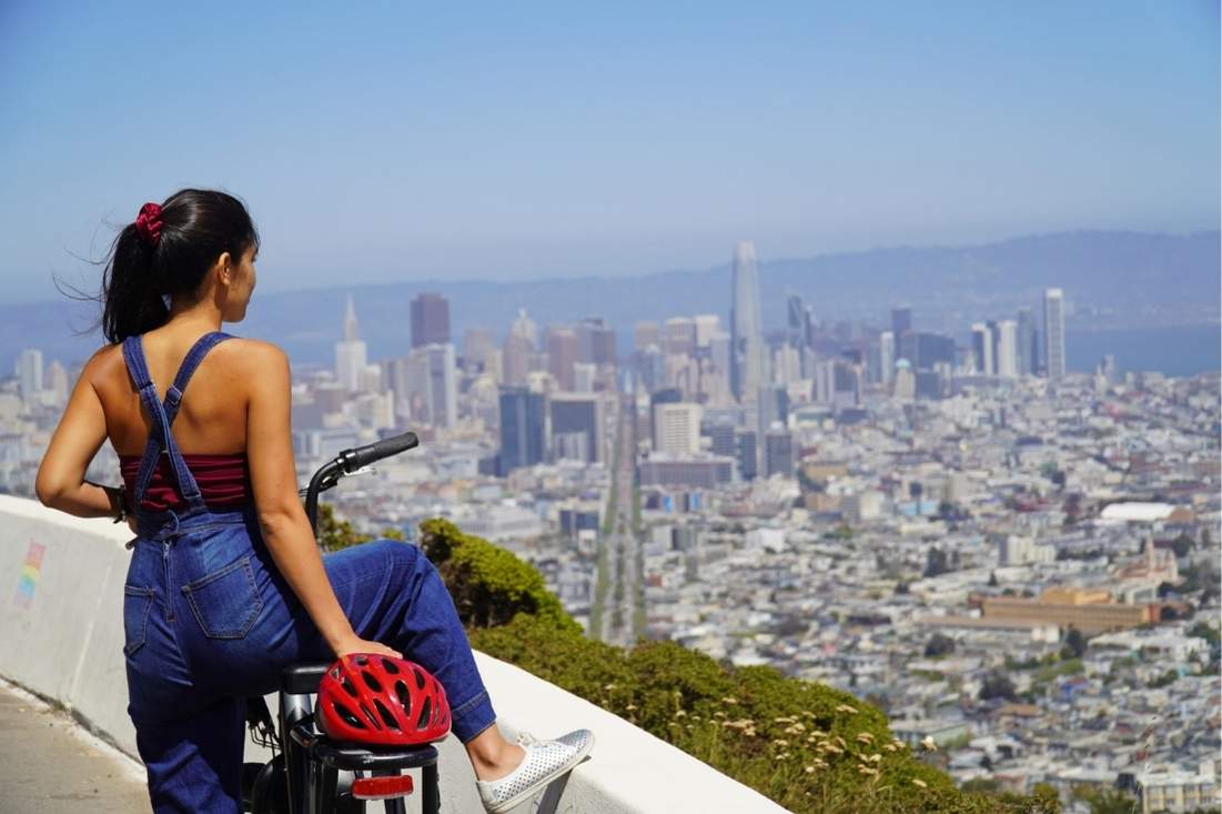 bike-rentals-sf-1 person on a bike looking out over san francisco