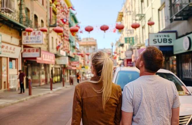 man and woman exploring chinatown in san francisco