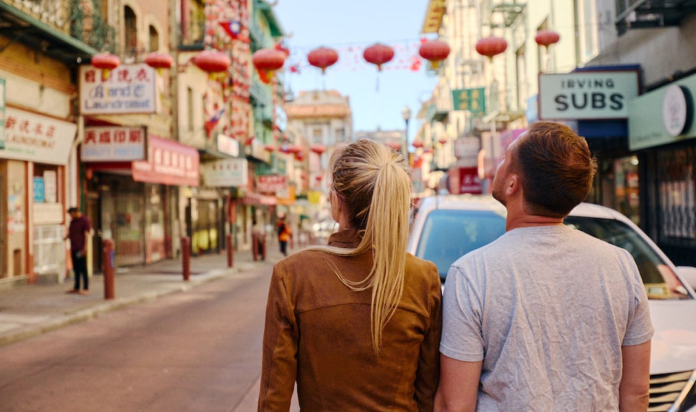 two people walking through chinatown in sf
