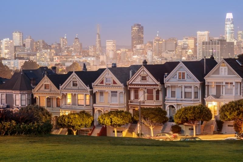 row of painted ladies house in evening light