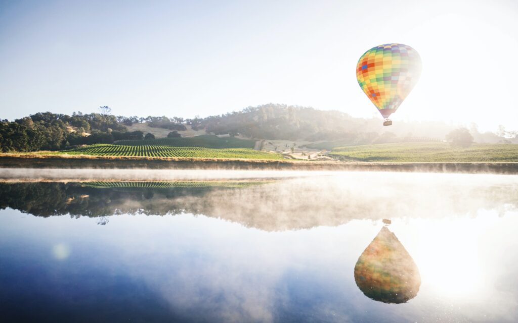 a hot air balloon flying over Napa Valley