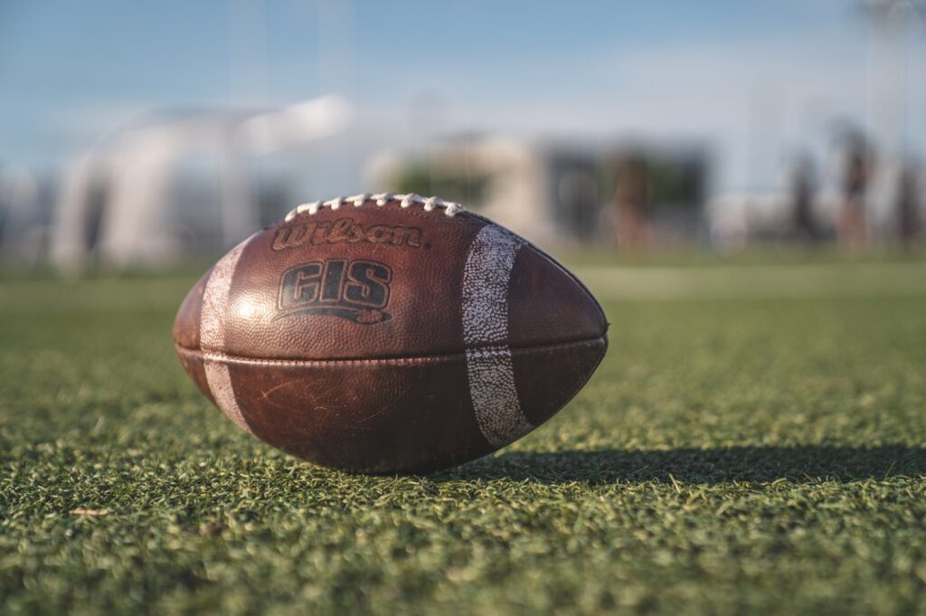 Football on grassy field