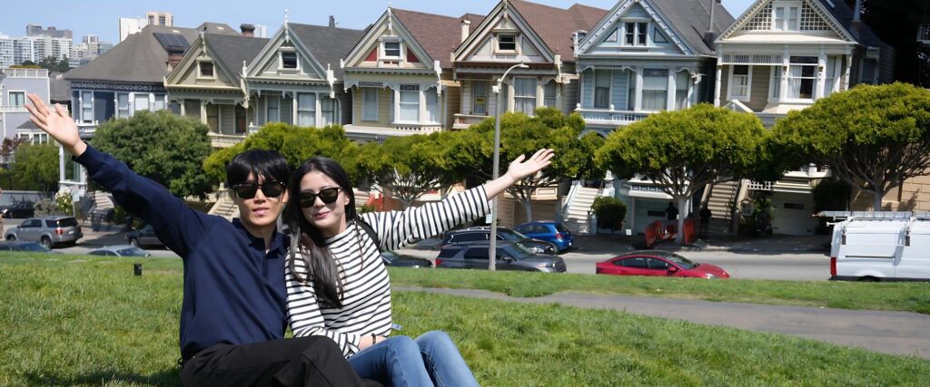 Couple on Dylan's Combo Tour in front of Painted Ladies in San Francisco