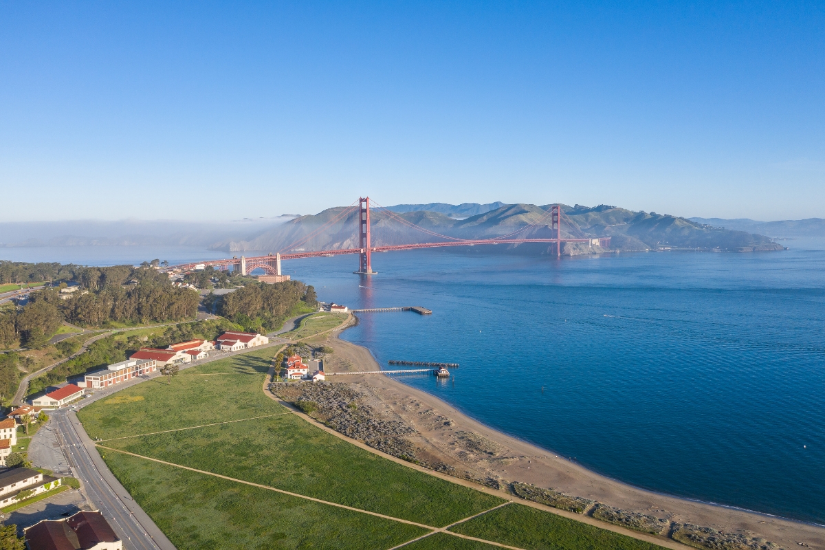 Panoramic view of Golden Gate Bridge spanning San Francisco Bay with Marin Headlands in background