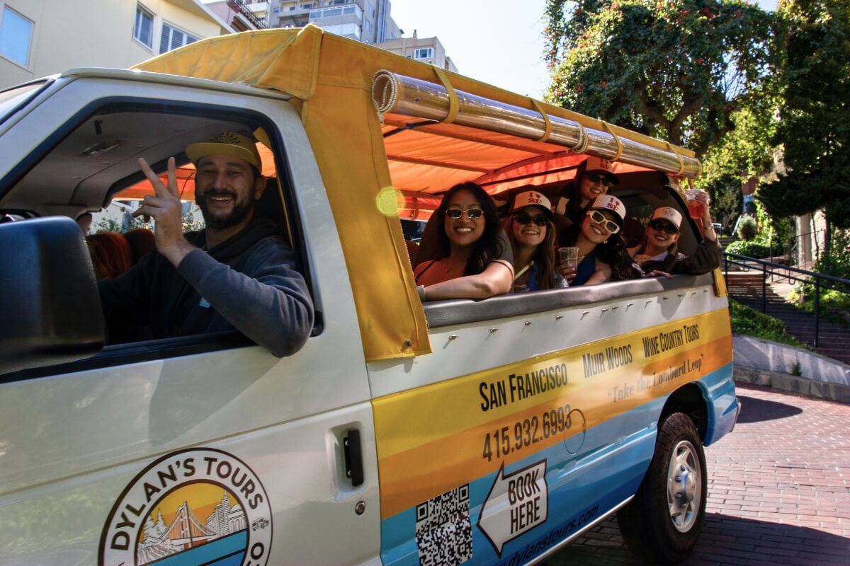 Dylan's Tours sightseeing van with tourists enjoying San Francisco tour near Lombard Street