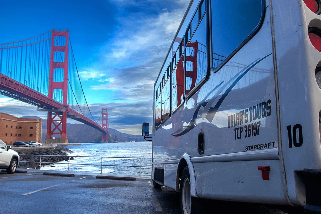 Dylan’s tour bus parked with the Golden Gate Bridge visible in the background