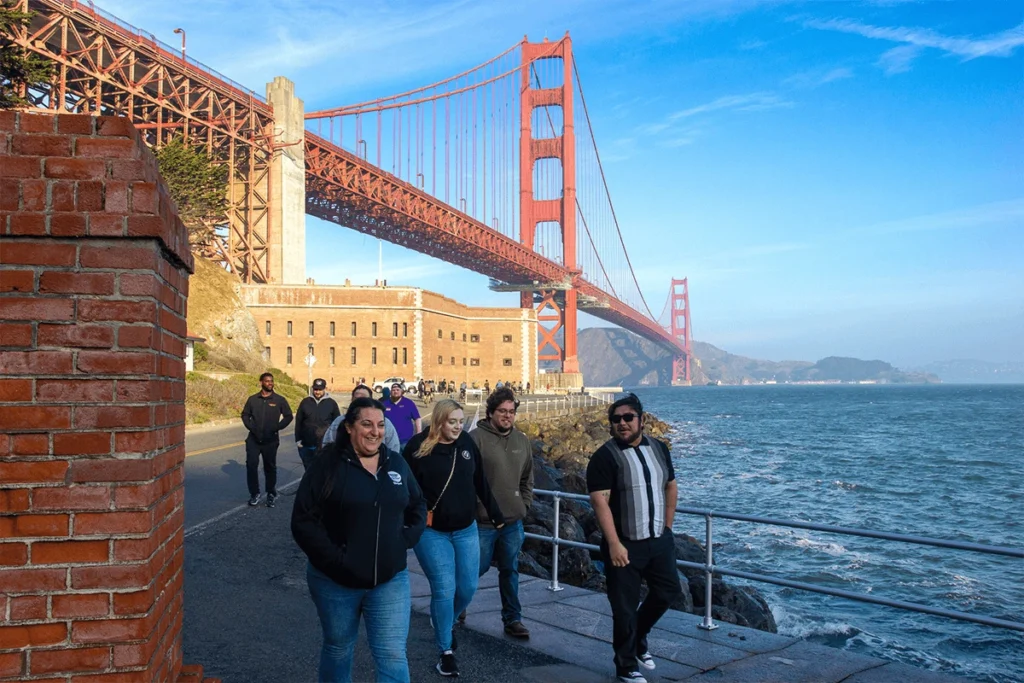 Dylan’s Tours van parked near the Golden Gate Bridge with scenic background