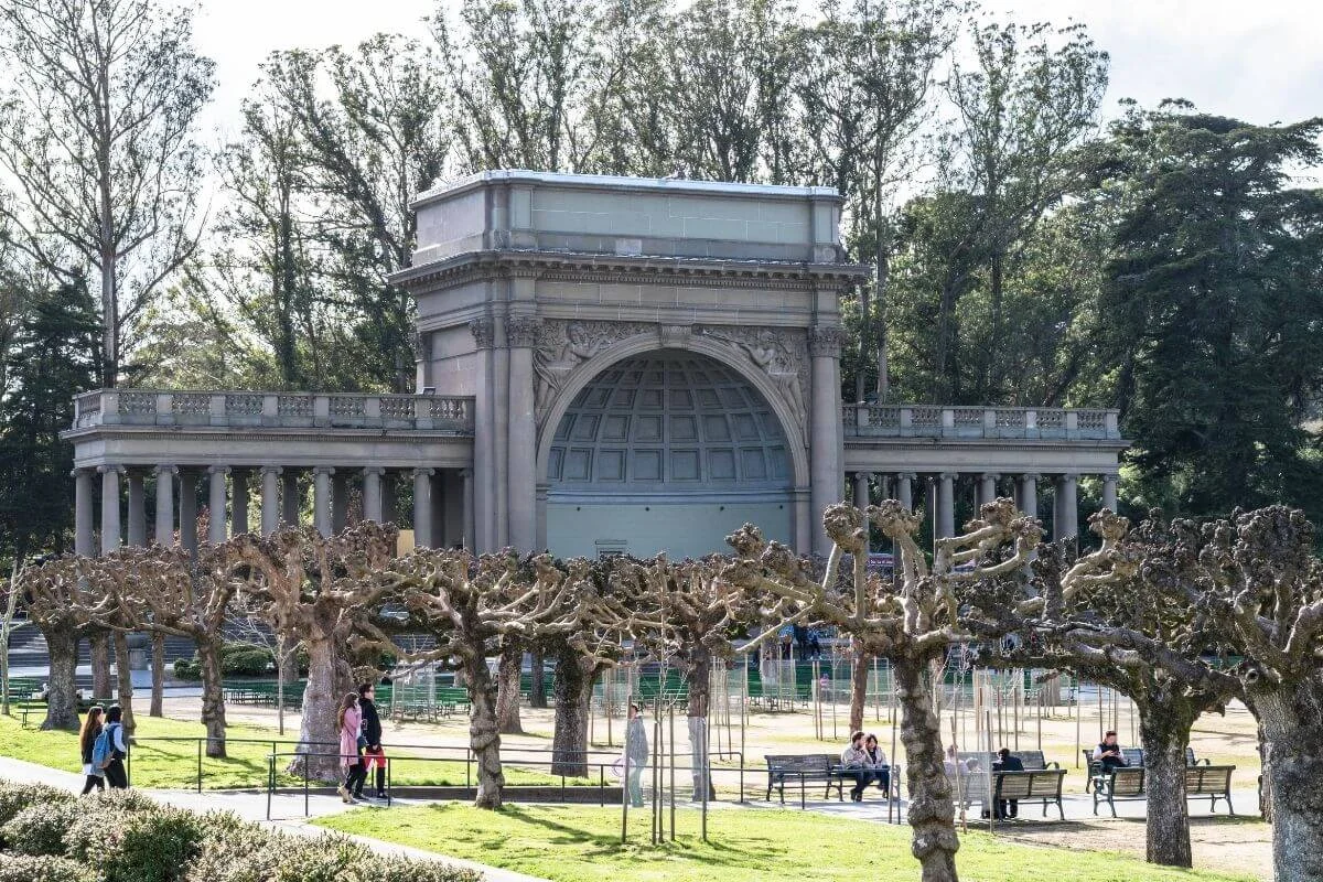 People relaxing and walking near the music concourse bandshell in Golden Gate Park, San Francisco