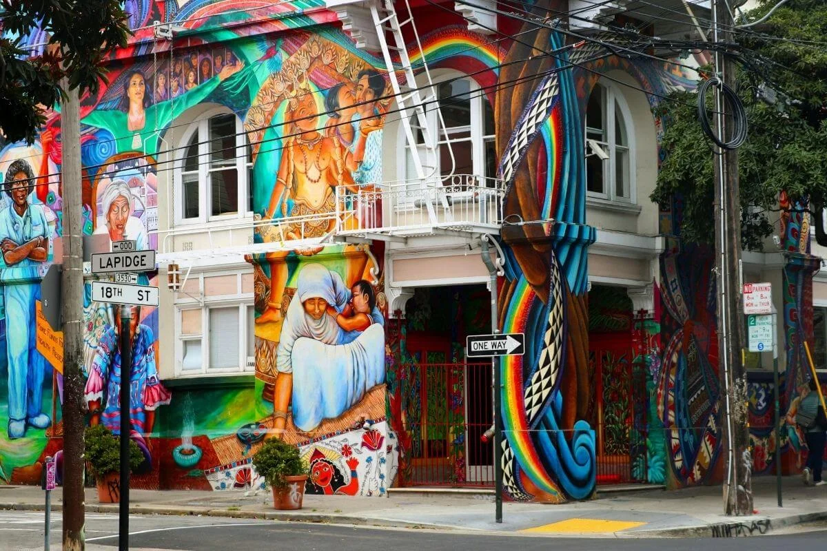 Vibrant street mural in San Francisco’s Mission District featuring cultural artwork, bold colors, and detailed community-inspired designs.