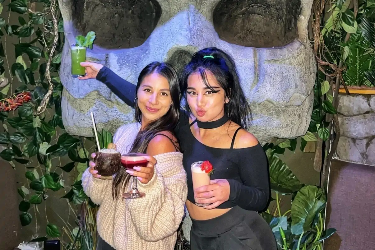 Friends enjoying handcrafted cocktails at a San Francisco tiki bar