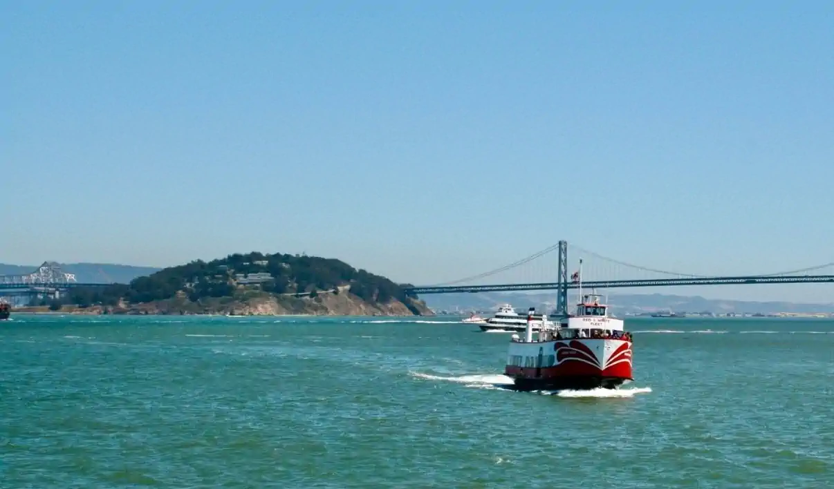 Red and White Fleet ferry cruising across San Francisco Bay