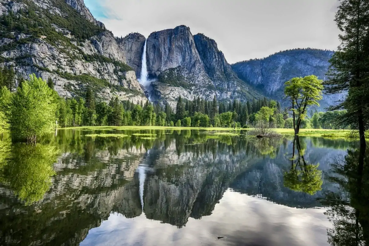 Yosemite Falls reflected in a lake at Yosemite National Park