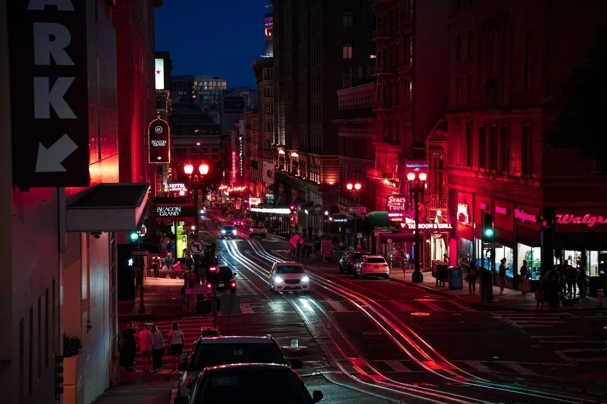 Union Square street at night with neon signs and traffic